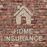 Home Insurance Concept on the Brown Brick Wall.