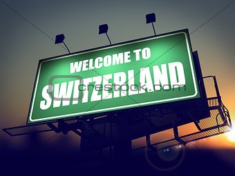 Billboard Welcome to Switzerland at Sunrise.