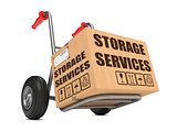 Storage Services - Cardboard Box on Hand Truck.