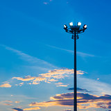 Light pole on blue sky background
