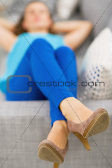 Closeup on young woman laying on sofa