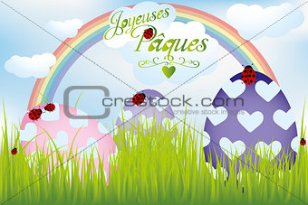 French Easter card with rainbow, eggs in green grass and ladybug