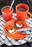 Pancakes with red caviar and sour cream