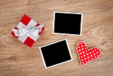 Blank photo frames and small red gift box