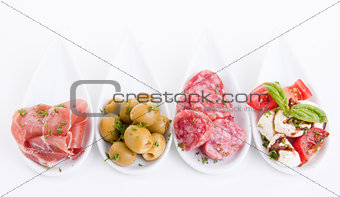 deliscious antipasti plate with parma parmesan and olives