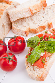deliscious fresh bruschetta appetizer with tomatoes isolated