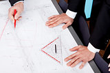 business people discussing architecture plan sketch 