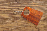 Label with chain on wooden background