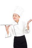 Chef  holding tray and smelling something