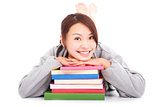 asian young  student lying on stacked books