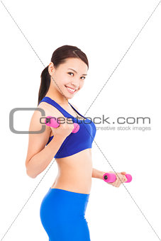 Shot of a sporty young woman with dumbbells