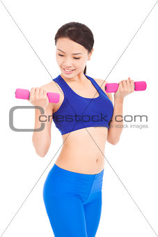 beautiful sporty muscular woman working out with dumbbells