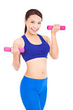 Happy fitness woman lifting dumbbells smiling cheerful,