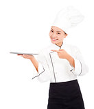 Pretty cook woman chef holding tray and looking