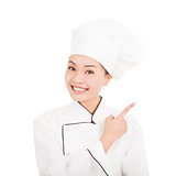 Asian young woman chef pointing direction