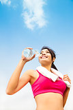 asian woman drinking water after fitness exercise