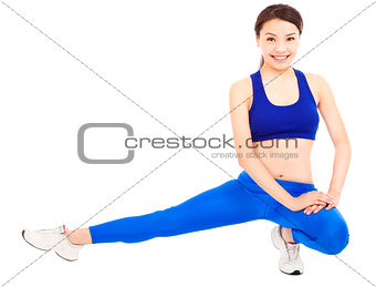 smiling  woman doing core workout, warm up body