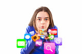 Teenage girl blowing app icons from digital tablet