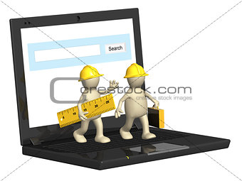 Two builders and laptop
