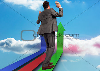 Composite image of businessman posing with hands up