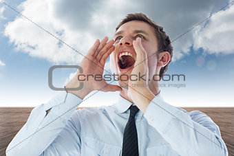 Composite image of businessman shouting