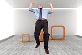 Composite image of businessman posing with arms up