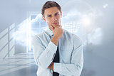 Composite image of thinking businessman with hand on chin