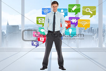 Composite image of smiling businessman standing with hands in pockets