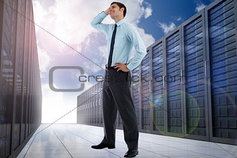 Composite image of thoughtful businessman with hand on head