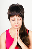Young attractive girl praying