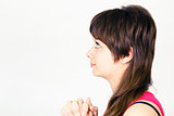 Young attractive girl praying