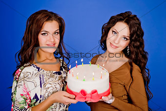Two young happy woman with a gift