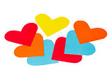 Many paper colored heart shapes on a white background