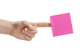 female teen hand holding purple sticky note