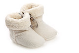 Pair of baby booties over white