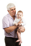 Portrait of a mature grandfather holding grandson over white