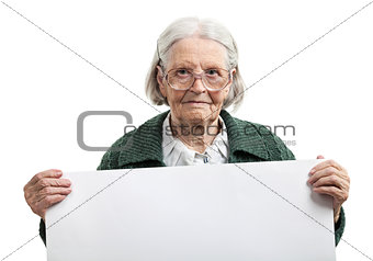 Happy elderly lady holding blank sheet in hand over white