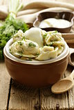 traditional Russian dumplings served with dill and sour cream