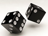 two black dices falling