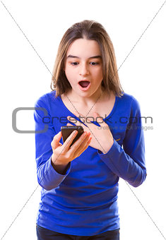 Surprised teenage girl with smartphone