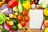 Fresh Vegetables on Wooden Background and Notebook 
