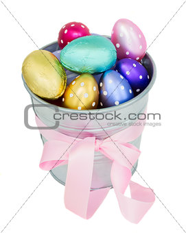 multicolored easter eggs in metal  pot