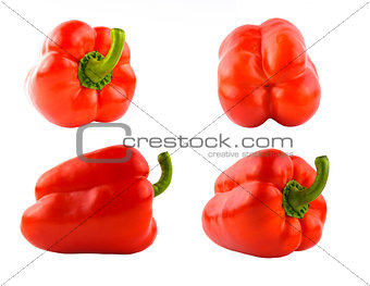 Four red sweet peppers set different sides