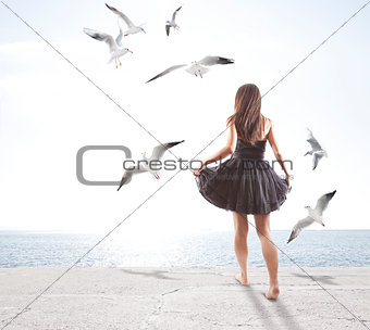 Young girl with seagulls
