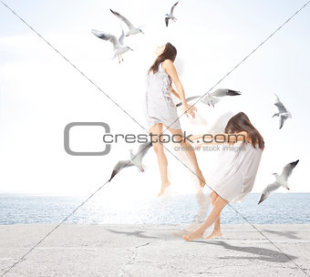 Young girl with seagulls, separation of the soul concept