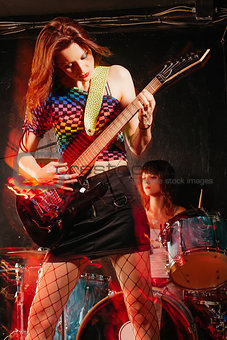 Women playing rock music on stage