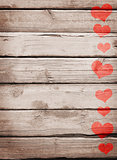 Red hearts painted on a wooden surface