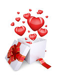 Red hearts fly out of an open gift box