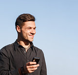 young male holding cellphone