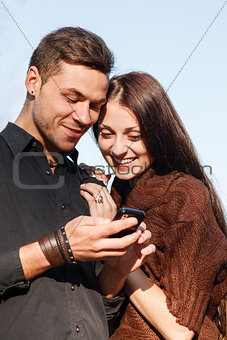 male and female reading sms